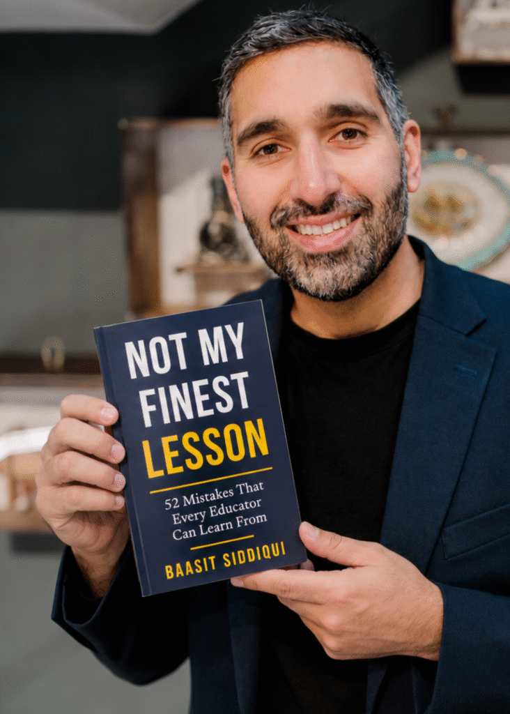 Baasit Siddiqui holding his book, Not My Finest Lesson
